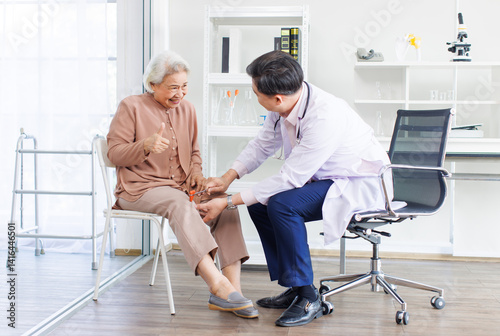 Asian orthopedic doctor consultation explaining treatment methods of trauma to retired old woman leg injury knee pain of patient in hospital physical therapy rehabilitation medical health care support