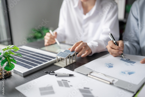 Fotografie Solar panels green energy Business man working green eco friendly office business creative idea Planing Bio economy for business eco friendly professional Engineer sustainable electricity