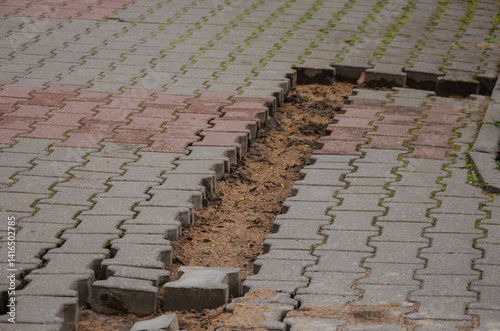 Repair of the sidewalk on the street with tiles