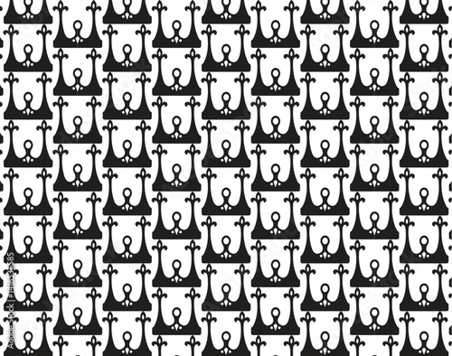 This is a vector seamless pattern design with a cute and fun set of black cartoon numbers and alphabet letters creating a playful texture for children's wallpaper