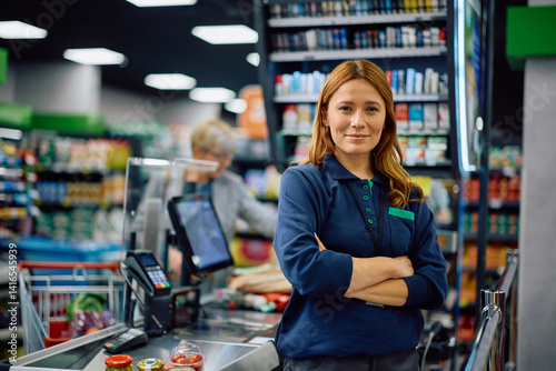 Foto Portrait of confident supermarket cahier looking at camera.