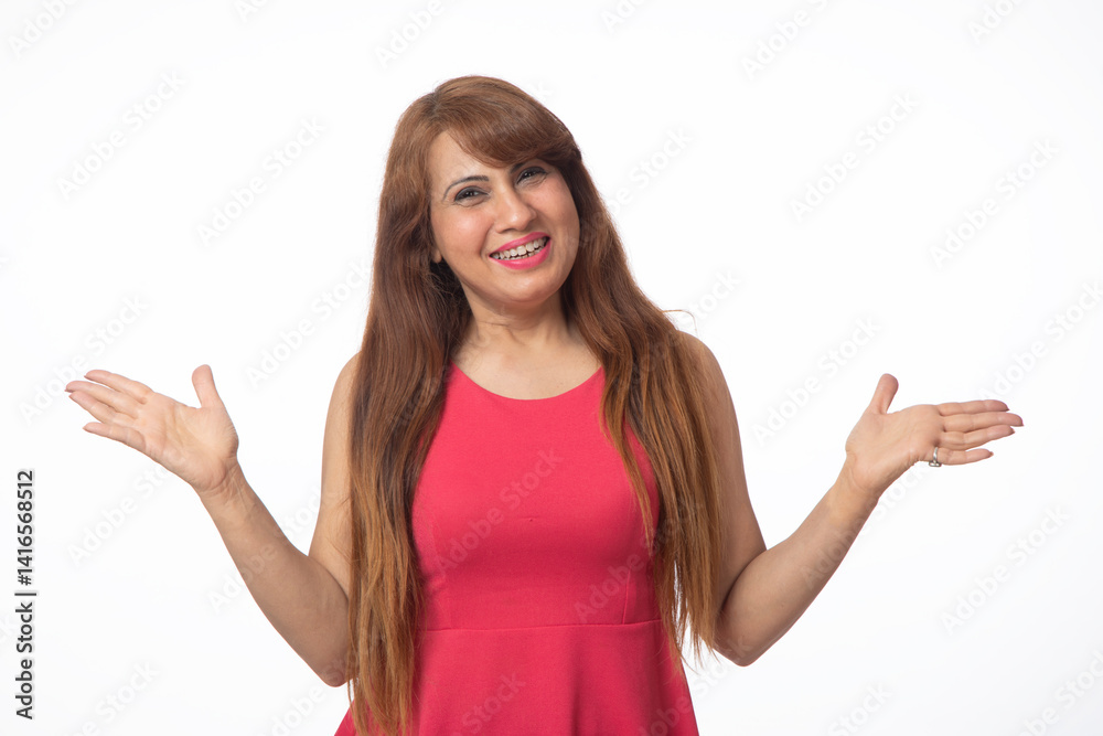 Portrait of happy smiling woman pointing finger isolated on studio background. Indian woman looking at camera pointing at copy space in formal clothes isolated in white Portrait of happy smiling woman pointing finger isolated on studio background. Indian woman looking at camera pointing at copy space in formal clothes isolated in white