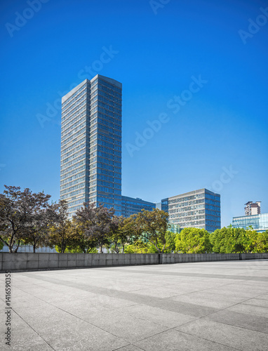 Contemporary Urban Landscape with Towering Skyscraper and Greenery