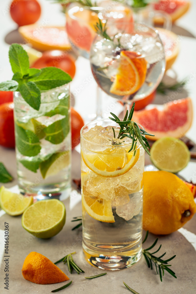 Refreshing summer cocktails with citrus on a white marble table. Refreshing summer cocktails with citrus on a white marble table.