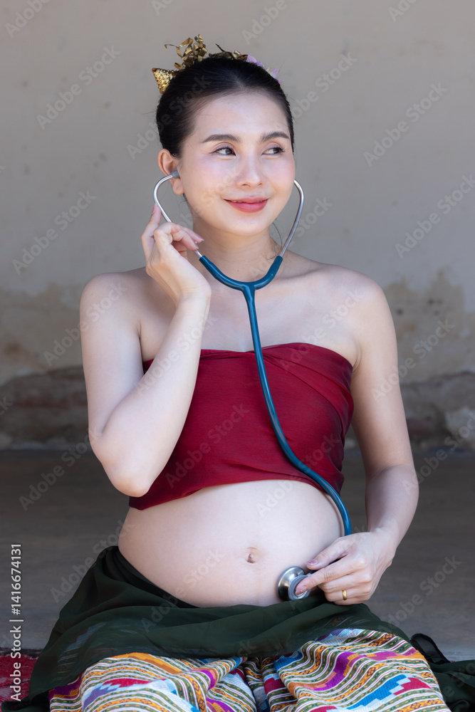 Pregnant woman with stethoscope on belly during prenatal checkup, Close up asian woman pregnant use stethoscope to checkup listen with belly of pregnant mother, Pregnancy checkup with stethoscope.