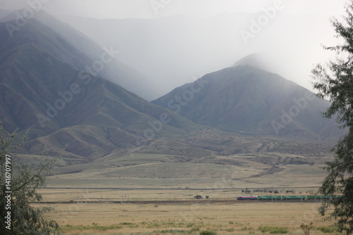 plain. mountains, fog. fog settles from the mountains into the valley before the weather changes