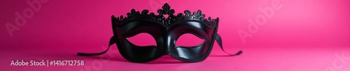 Seductive black eye mask on vibrant pink background for intimacy play, passion, kink, hidden