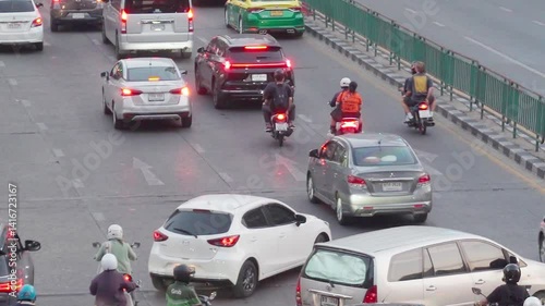 Traffic congestion on Ratchadaphisek Road in Bangkok Traffic of cars and people on highways