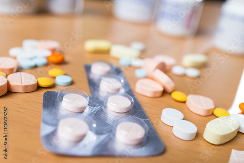 Scattered prescription drugs on brown table