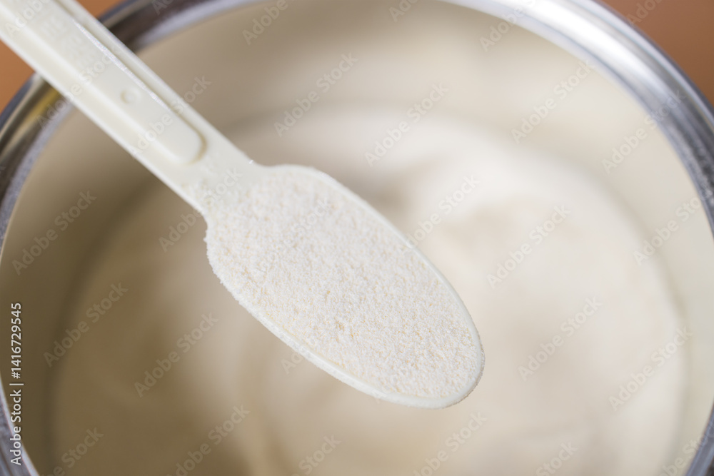 Closeup of infant formula powder and scoop