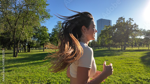 Obraz na płótnie Young woman running and jogging in urban park. w salonie