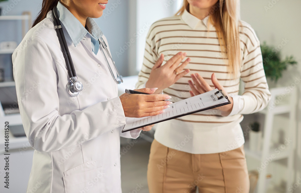Woman doctor, gynaecologists, endocrinologists, private GP specialising in female care health consulting on menopause, contraception, anti-ageing, planning in clinic, hospital visit, feminist center