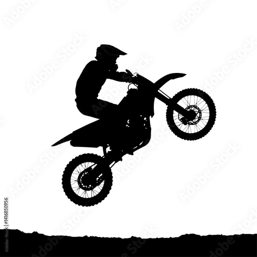 Silhouette of Motocross Rider Performing a Wheelie