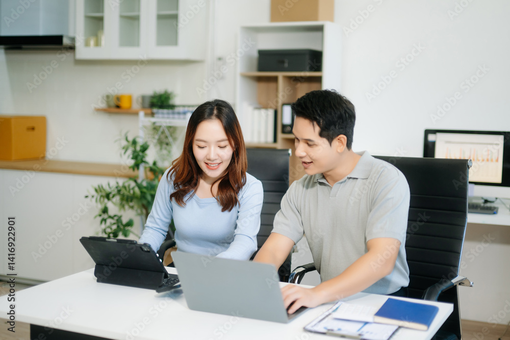 Male discussing new project with male colleague. Young woman talking with young man Male discussing new project with male colleague. Young woman talking with young man
