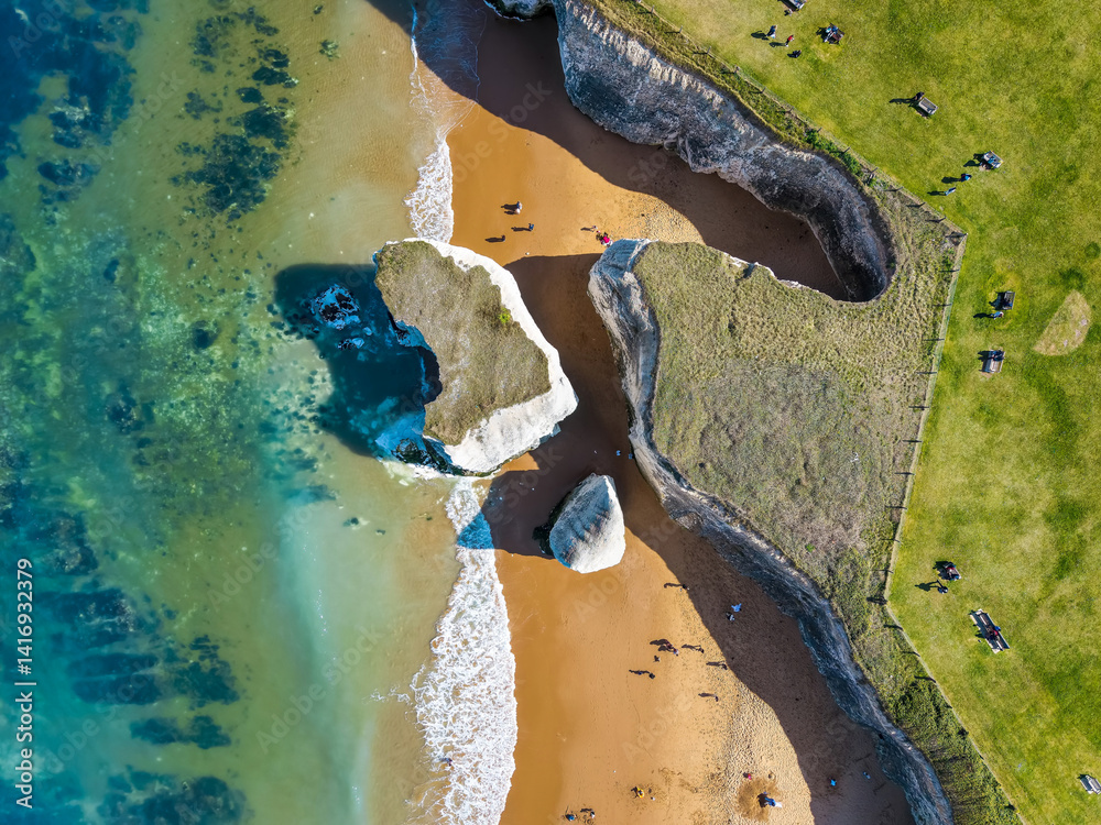 Aerial overhead view of the white chalk cliffs sitting in the ocean at Botany Bay, Kent, England
