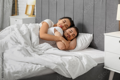 Loving young couple sleepin...