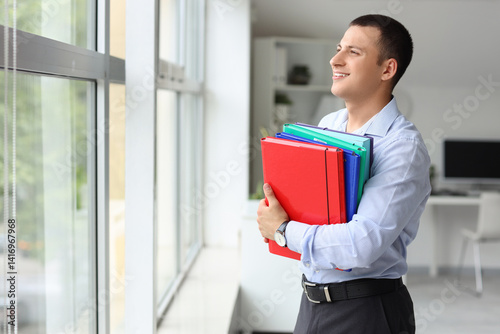 Smiling young businessman h...
