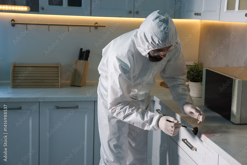 Forensic expert taking fingerprints from countertop with brush at crime scene indoors, space for text Forensic expert taking fingerprints from countertop with brush at crime scene indoors, space for text