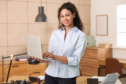 Smiling young businesswoman...