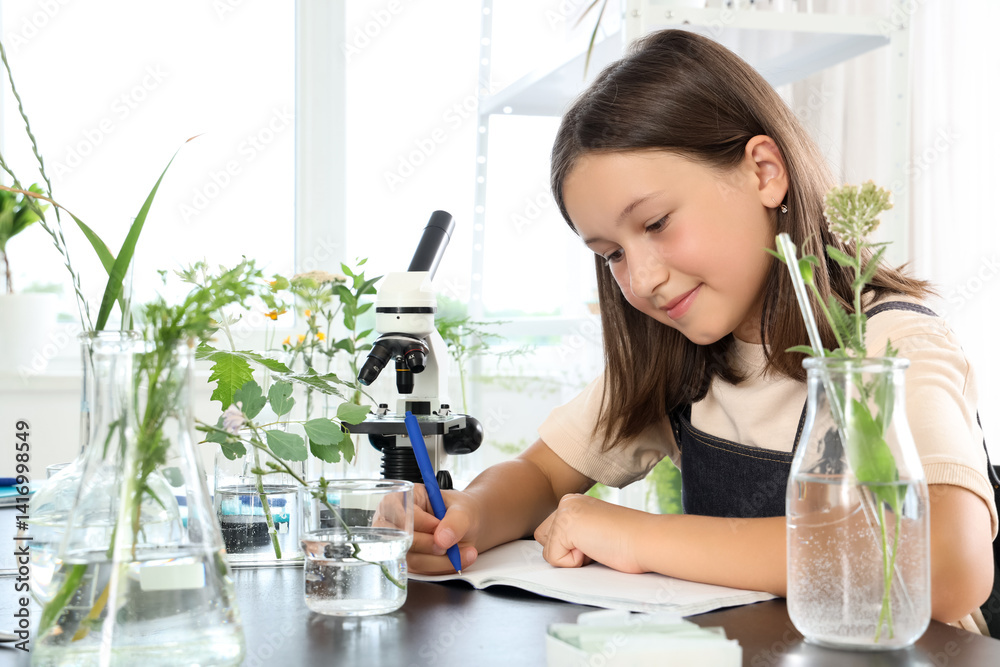 Teenage girl studying in Biology class at school Teenage girl studying in Biology class at school