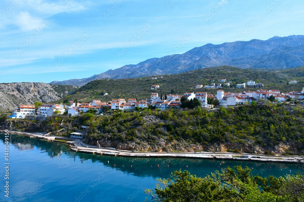 View of Stinica tourist village above the shore of the Adriatic sea and bellow Velebit mountains in Croatia