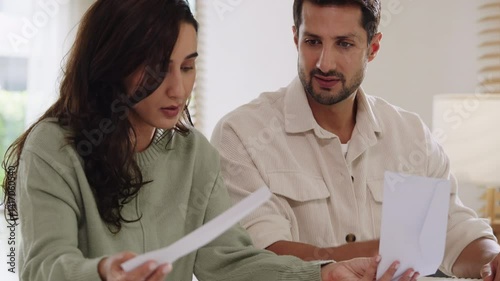 Couple facing overdue bills and financial pressure at home, stressed by inflation and economy recession
