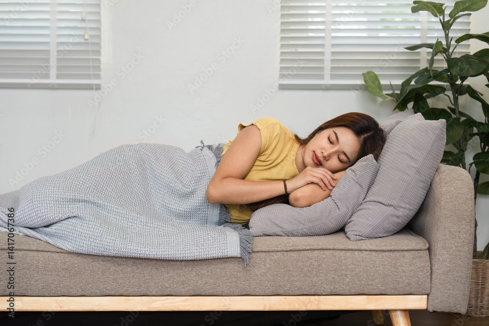 Morning Routine and Sleep. A woman peacefully sleeping on a cozy couch, enjoying her restful morning. Morning Routine and Sleep. A woman peacefully sleeping on a cozy couch, enjoying her restful morning.