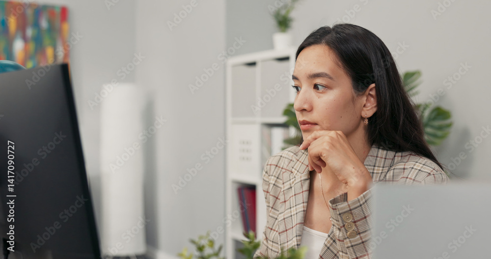 A focused pretty woman with long brown hair wearing a checkered jacket sits at desk in office in front of computer screen, reading news, articles, documents, analyzing propping hand under chin A focused pretty woman with long brown hair wearing a checkered jacket sits at desk in office in front of computer screen, reading news, articles, documents, analyzing propping hand under chin