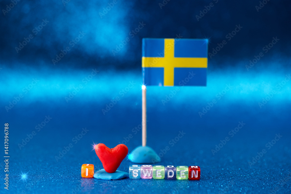 Craft display with Swedish flag and colorful blocks expressing love for Sweden at a creative workspace