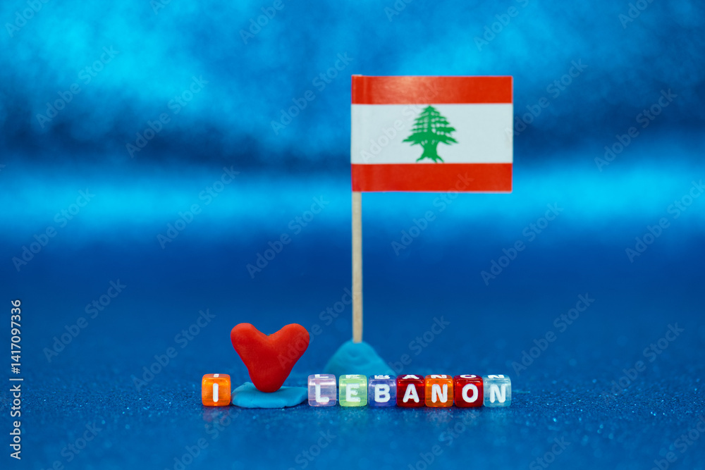Handmade heart and flag display showcasing love for Lebanon with colorful blocks on a blue background