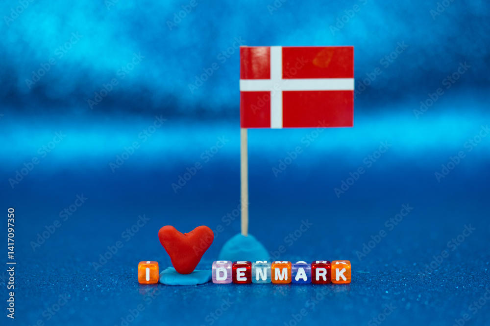 Colorful representation of Danish pride with a flag and decorative elements on a bright blue background
