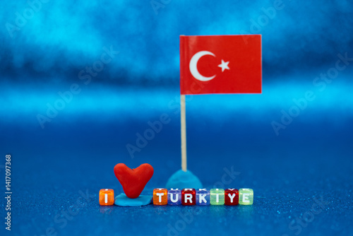 Obraz na płótnie Colorful display of love for Turkey with heart and flag against vibrant blue background w salonie