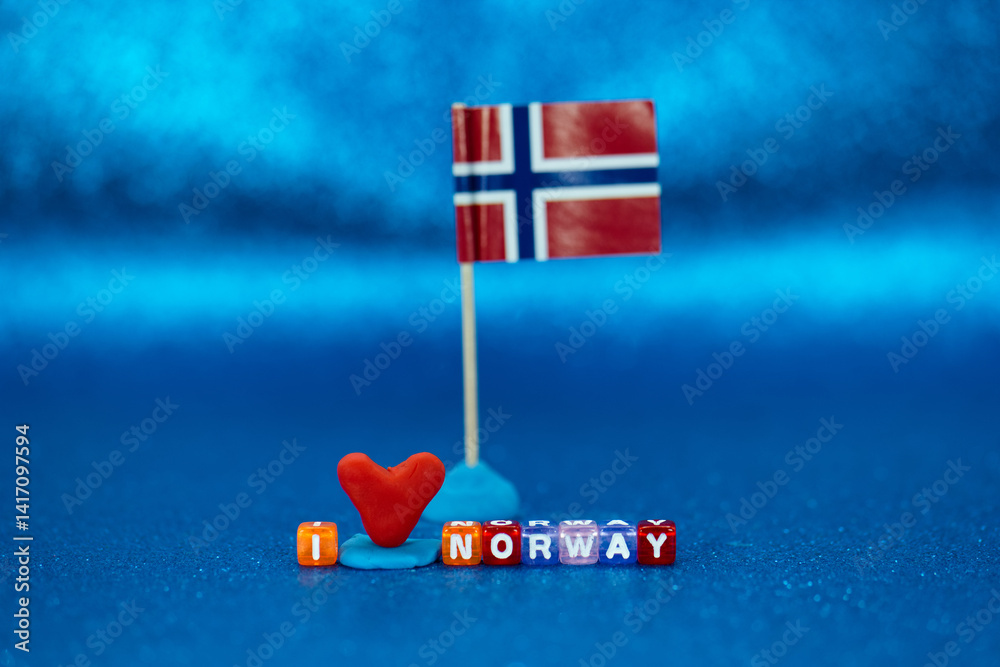 Creative display of a Norwegian flag and colorful letters conveying affection for Norway on a vibrant background