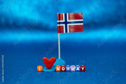 Obraz na płótnie Creative display of a Norwegian flag and colorful letters conveying affection for Norway on a vibrant background w salonie