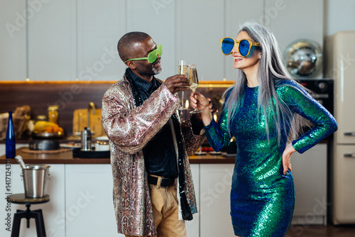 cinematic image of an happy multiethnic senior couple. Indoors Lifestyle moments at home. Concept about seniority and relationships