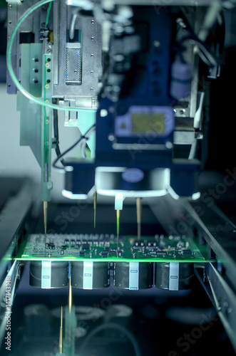 Circuit board moving through assembly line. Electronics component installation, CMD. Automated