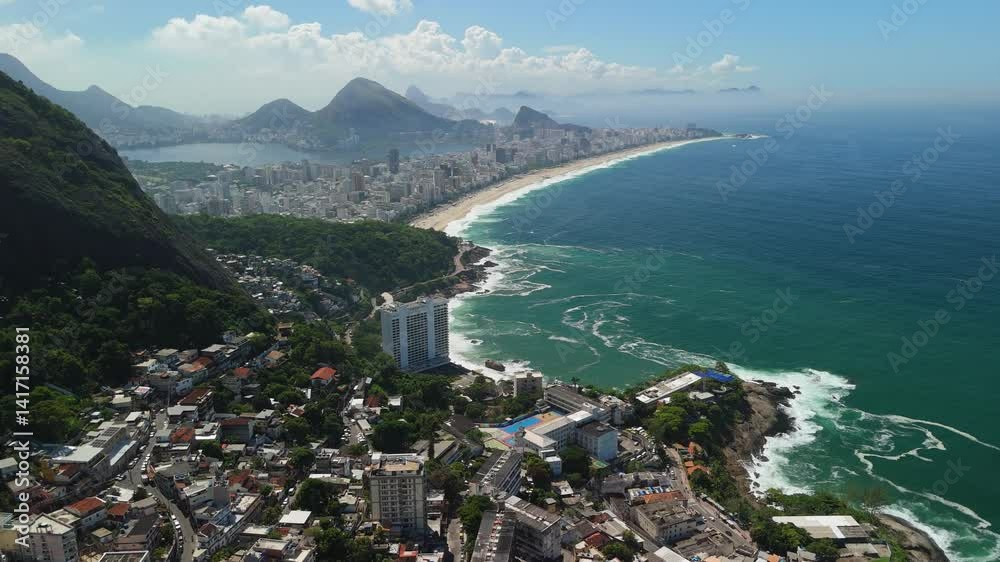 Aerial ascend over the cityscape of Rio de Janeiro, Brazil with sweeping views of the coastline and mountains