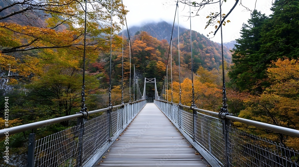 Obraz premium Scenic suspension bridge surrounded by vibrant autumn foliage showcasing nature's beauty in transition : Generative AI