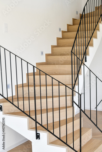 Wooden staircase in a new modern house, close up.