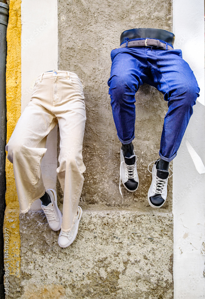 custom made wallpaper toronto digitalCreative display of pants and shoes hanging on a wall in a vibrant urban setting