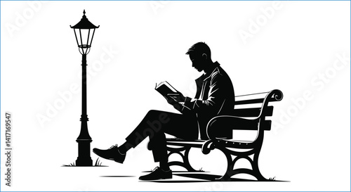 Silhouette Of Man Reading Book On Park Bench By Streetlight