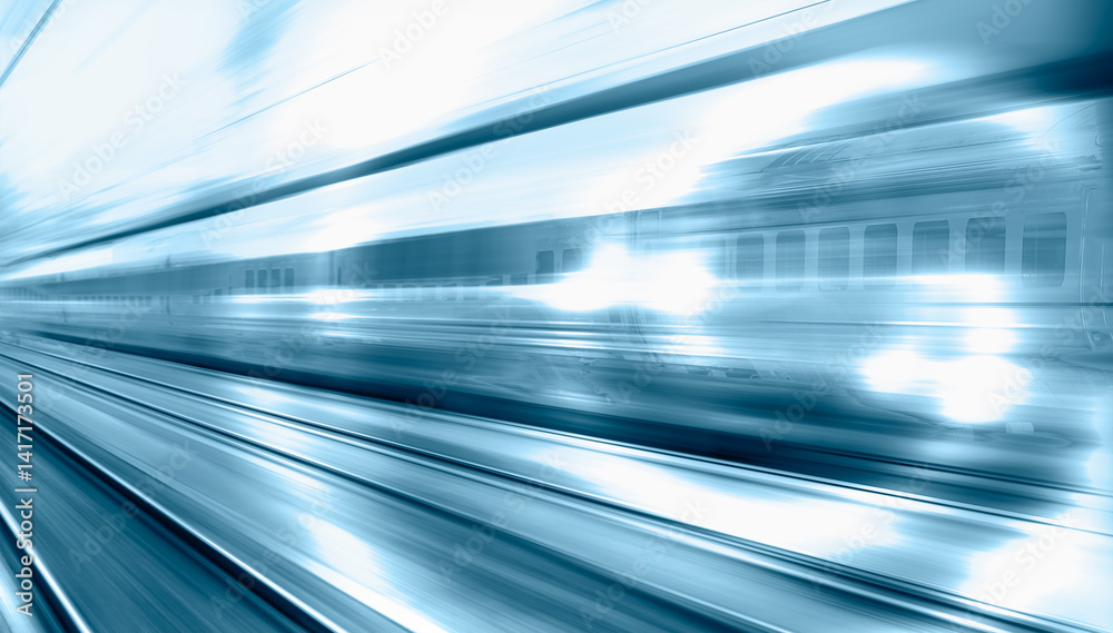 Blue high speed train runs on rail tracks - The train is going too fast as a result the air pressure is causing too much heat at the front