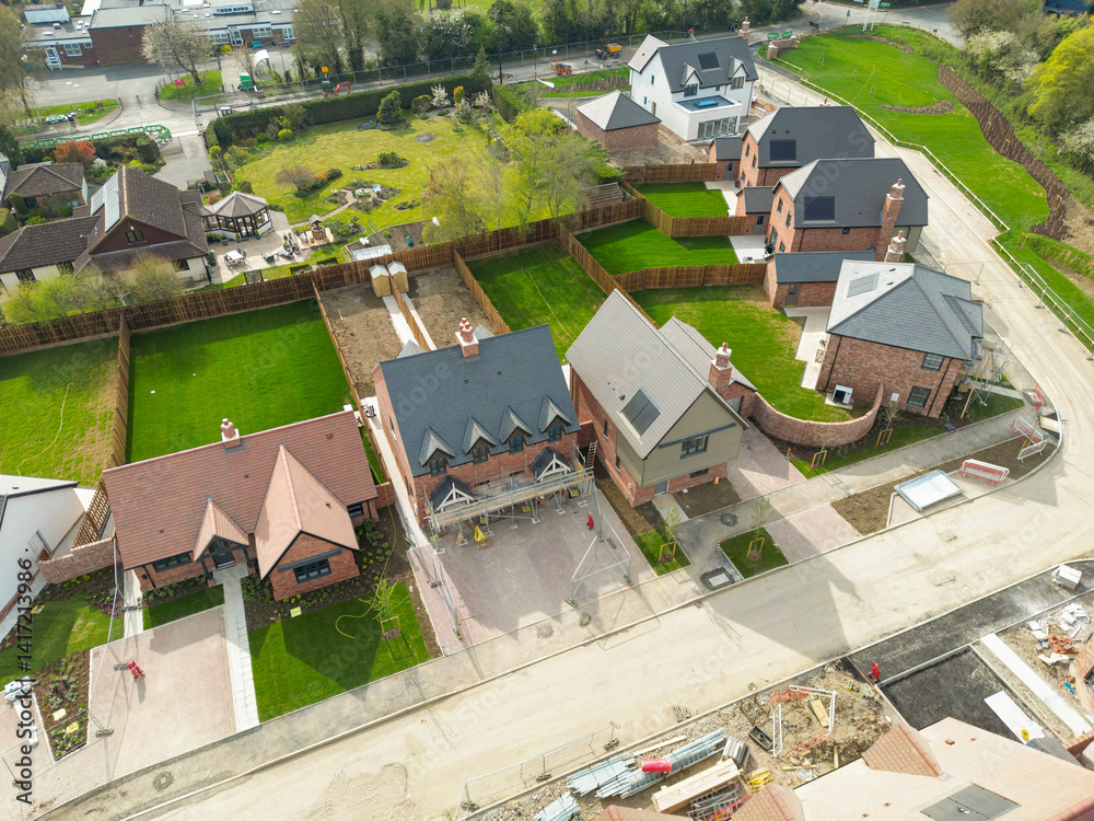 Aerial top down view of part of a British housing development site. Showing both expensive detached and affordable semi houses.