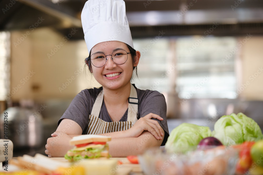 Culinary student standing confidently in training kitchen with fresh ingredients ready for cooking practice Culinary student standing confidently in training kitchen with fresh ingredients ready for cooking practice