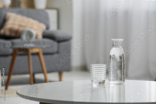 Bottle of water and glass o...