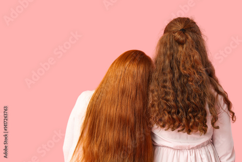 Young ginger woman and her ...