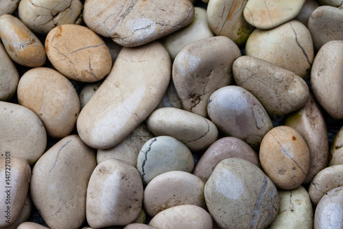 Small and medium sized white natural stones, commonly used for garden decoration. Natural stone texture and background for graphic design.