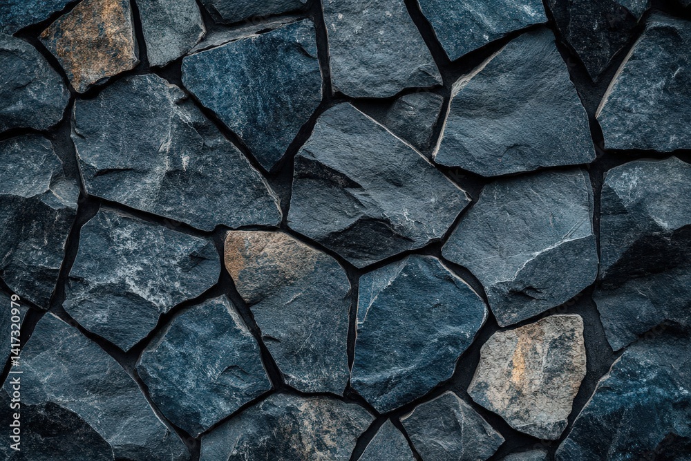 Fototapeta premium Black stone wall texture ideal for interior design or wallpaper. Dark rock surface in a dimly lit room, featuring 2/3 space for text overlay. Perfect for modern aesthetics.