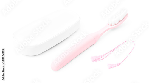 Dental floss, a pink toothbrush, and a white plastic case on a isolated background photo