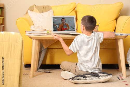 Little boy with laptop stud...